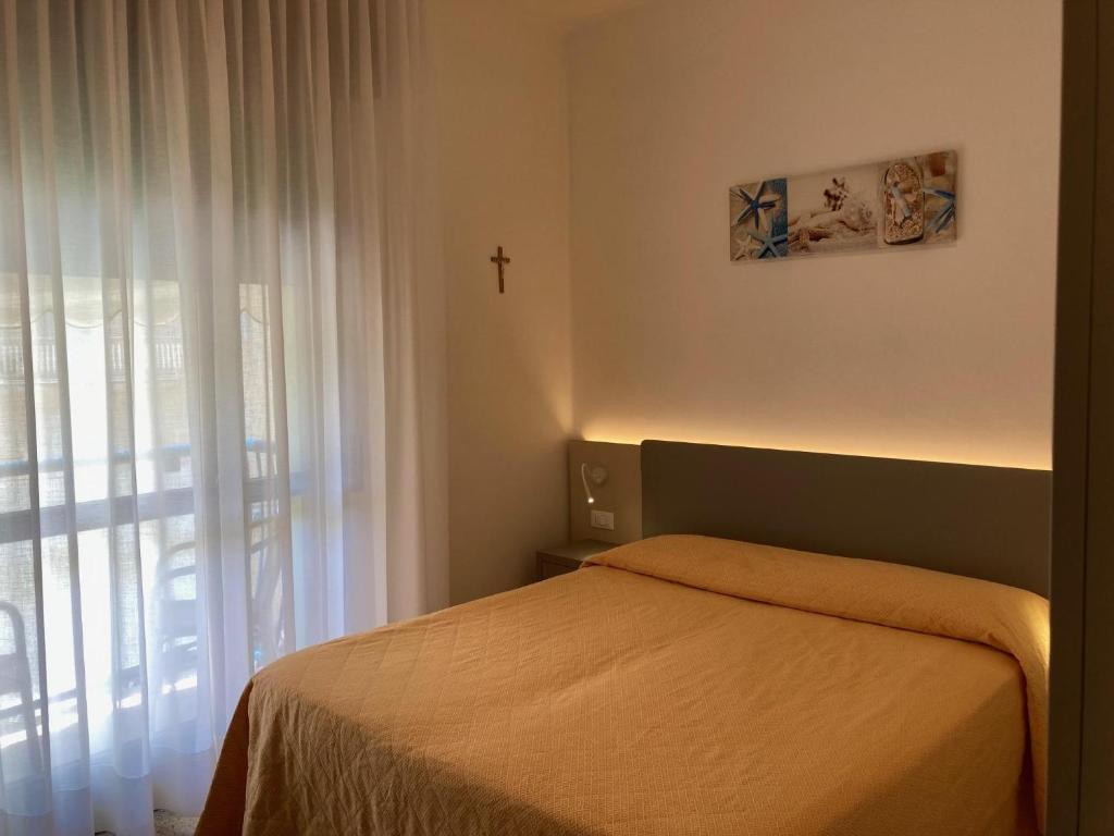 Postel nebo postele na pokoji v ubytování Hotel Giacomazzo