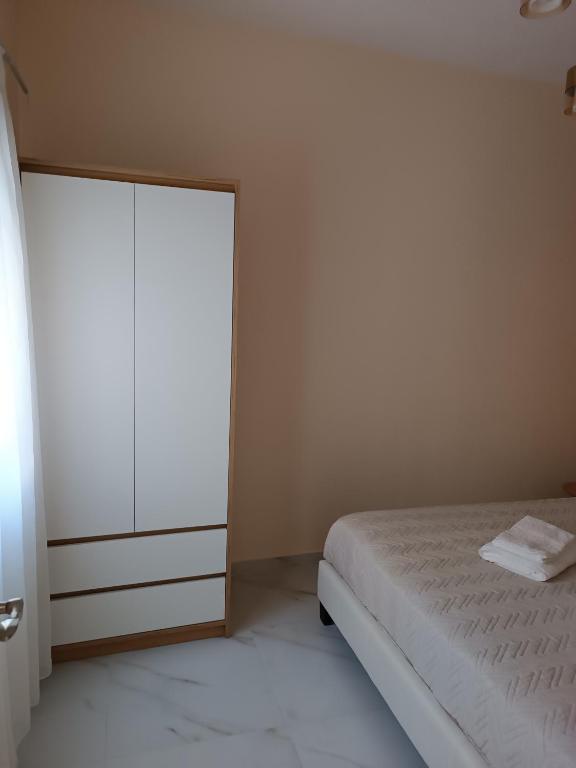 Postel nebo postele na pokoji v ubytování AEGEAN SUITES