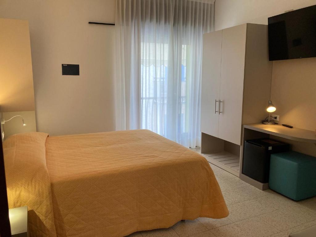 Postel nebo postele na pokoji v ubytování Hotel Giacomazzo