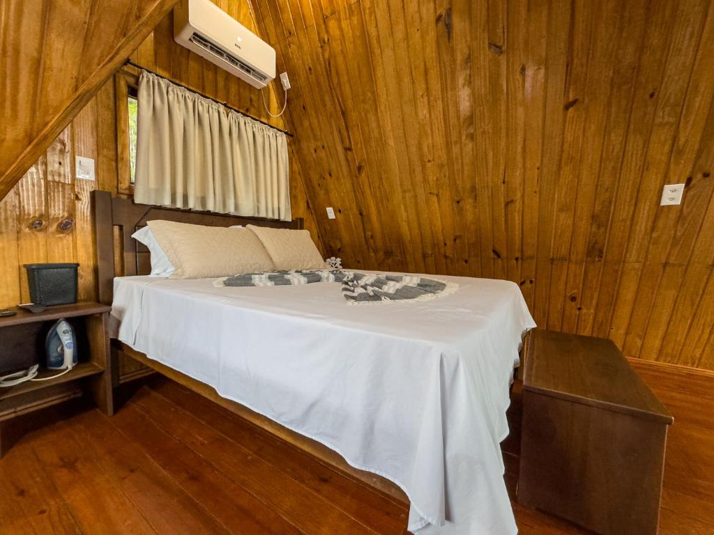 Postel nebo postele na pokoji v ubytování Morro dos Chalés