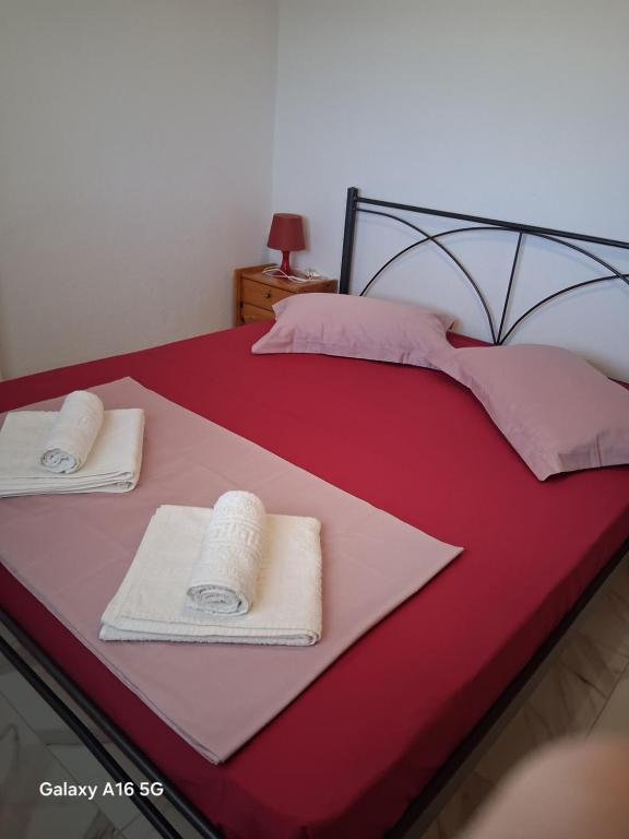 Postel nebo postele na pokoji v ubytování house chrisoula