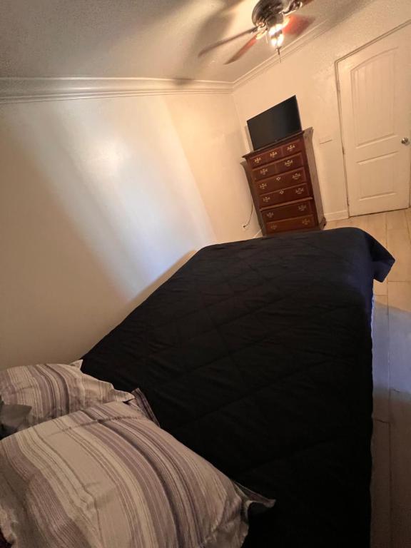 a bedroom with a bed and a ceiling fan at Downtown Secluded Room 2 in Phoenix