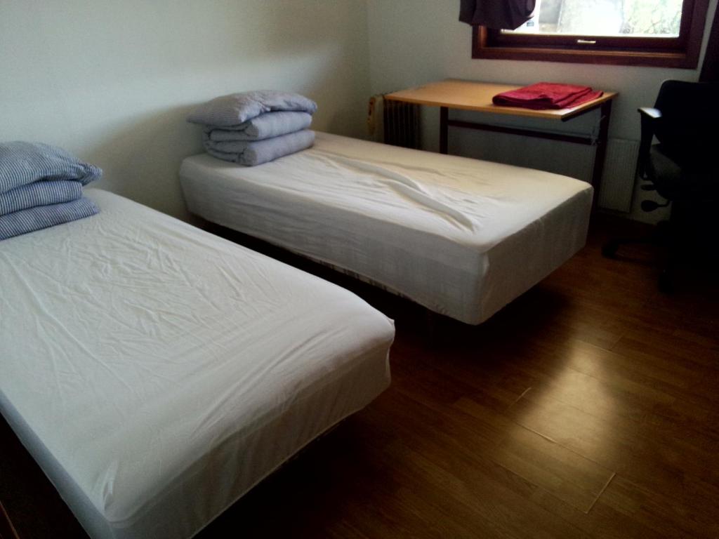Postel nebo postele na pokoji v ubytování Gardenview Room