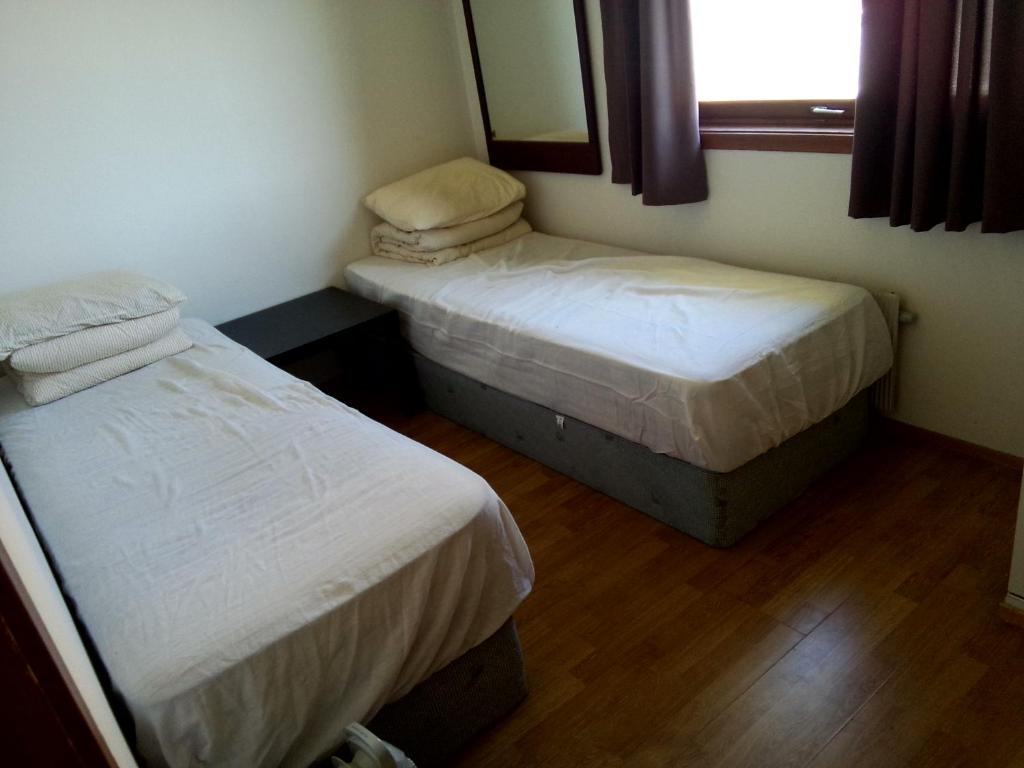 Postel nebo postele na pokoji v ubytování Gardenview Room