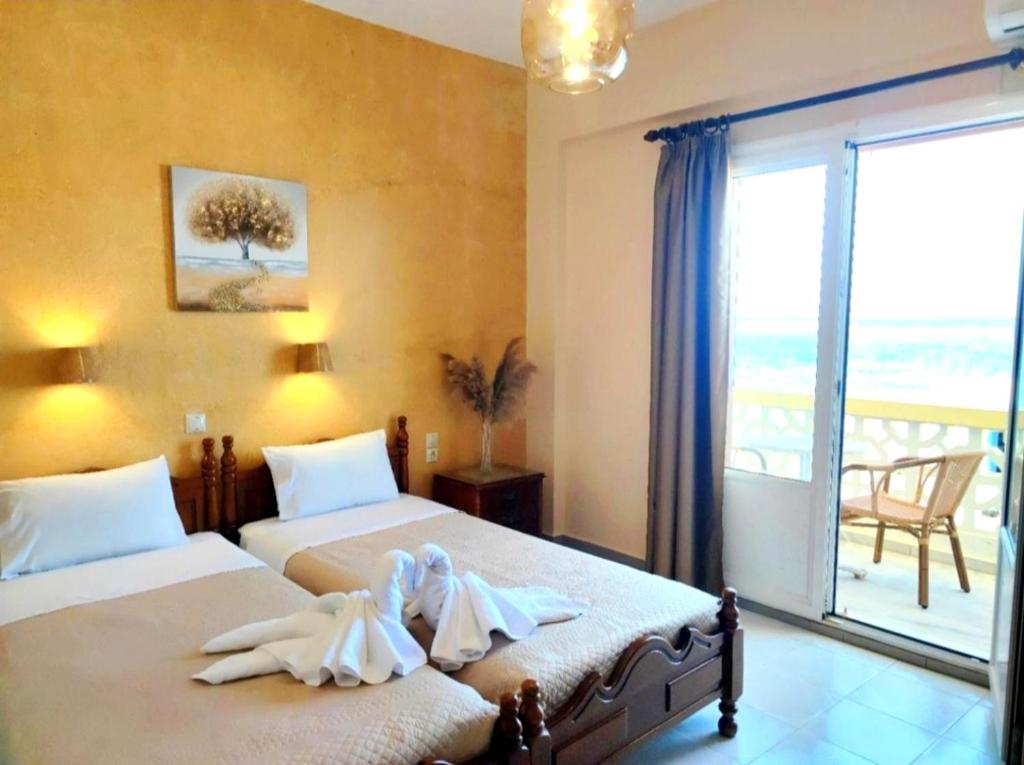 Postel nebo postele na pokoji v ubytování Borianoula Apartments