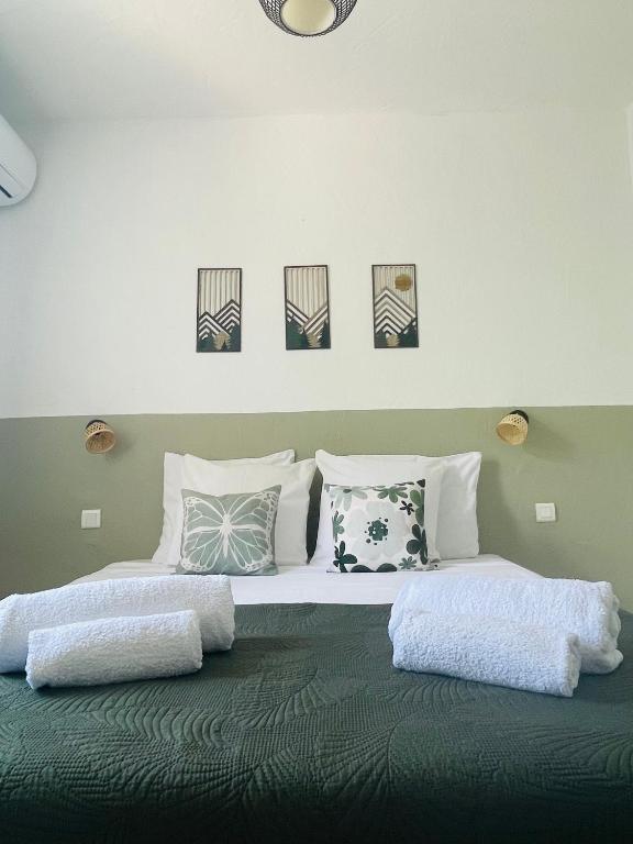 a bedroom with two beds with pillows on it at Fiori di Luna in Porto-Vecchio
