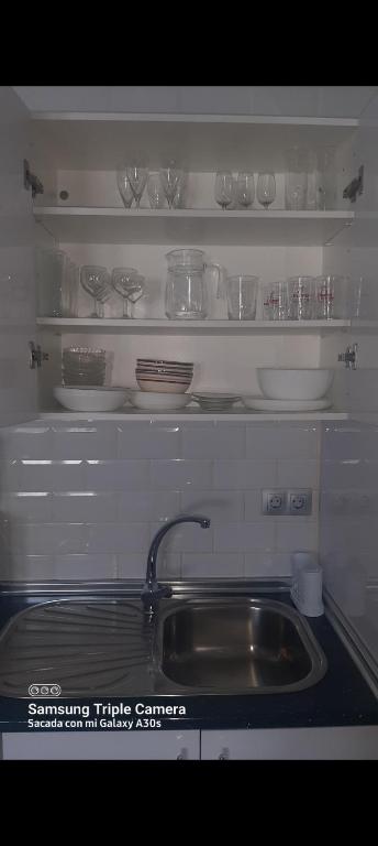 Kuchyňa alebo kuchynka v ubytovaní Merlo's Gaviotas. (Apartamento).