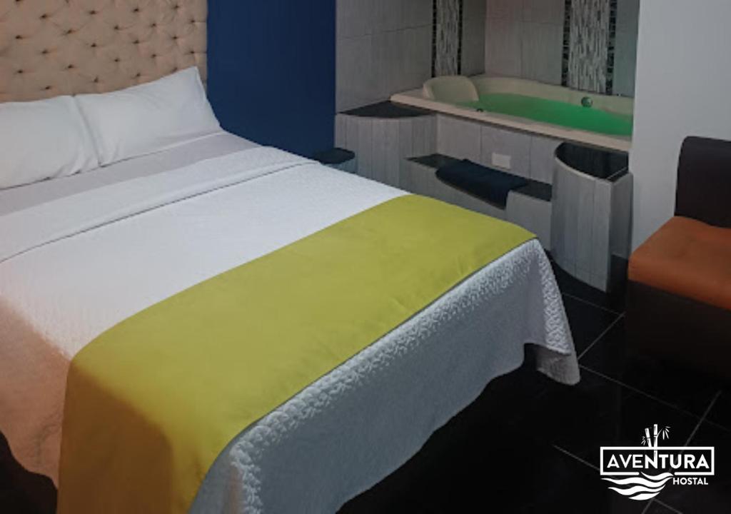 Postel nebo postele na pokoji v ubytování Hostal Aventura