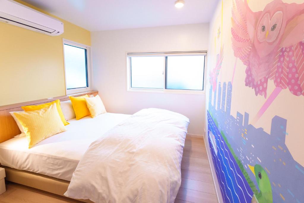 Postel nebo postele na pokoji v ubytování Luce Stay&Resort Evoluto101