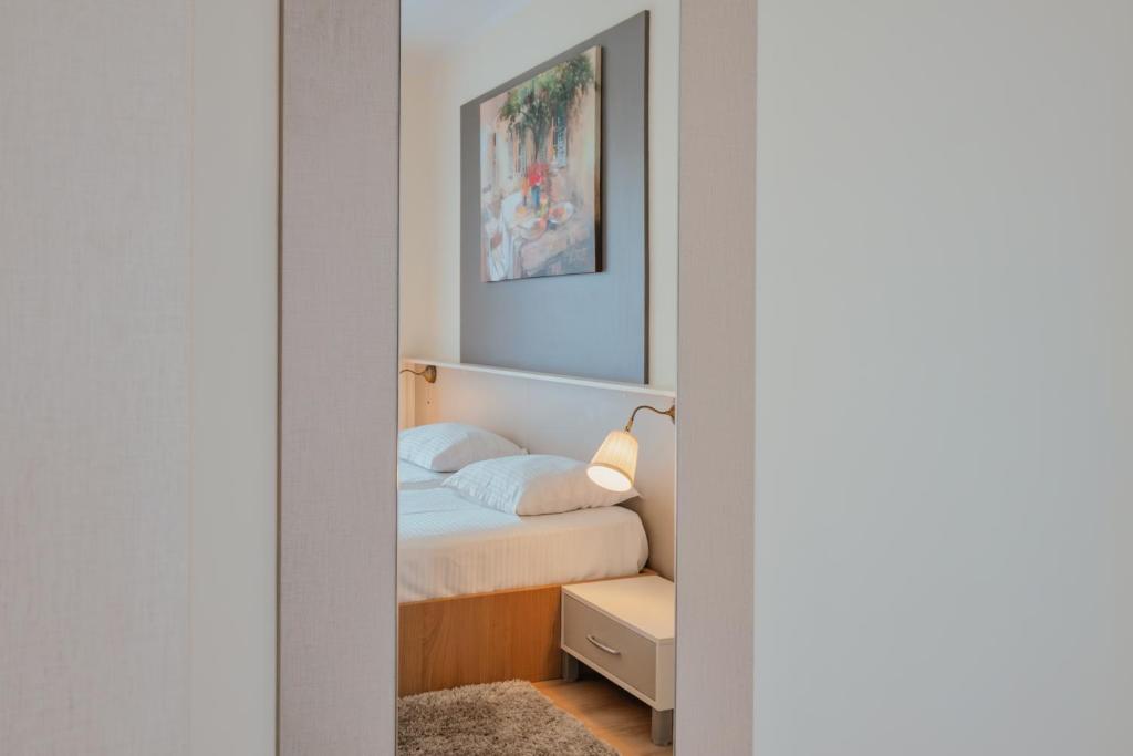 Postel nebo postele na pokoji v ubytování Luxury Apartments Vili