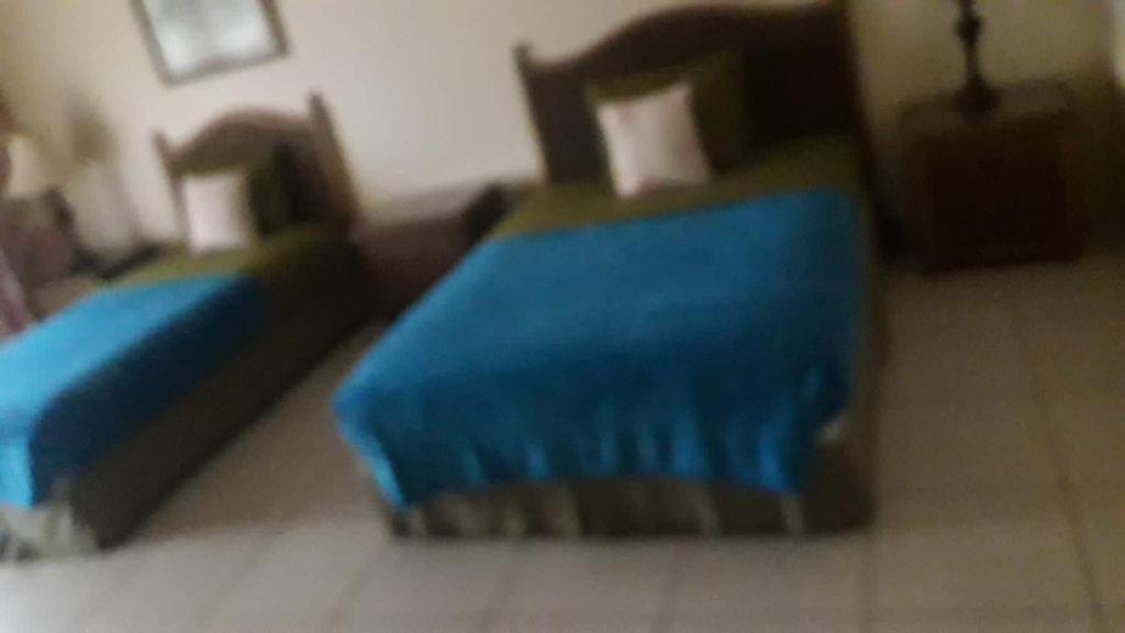 Postel nebo postele na pokoji v ubytování Caribbliss Suites