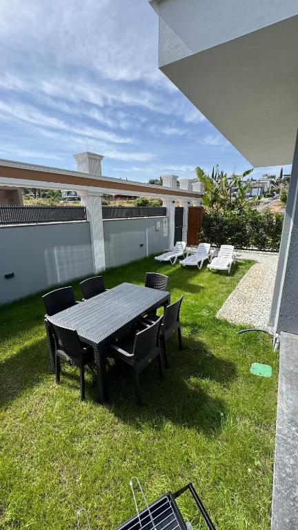a picnic table and chairs on top of a yard at Villa Lea - 4 km to the sea 9 km to the airport in Antalya