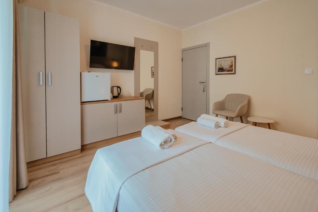 Postel nebo postele na pokoji v ubytování Luxury Apartments Vili