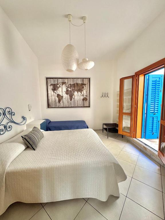 Postel nebo postele na pokoji v ubytování Il CORTILE DI EOLO
