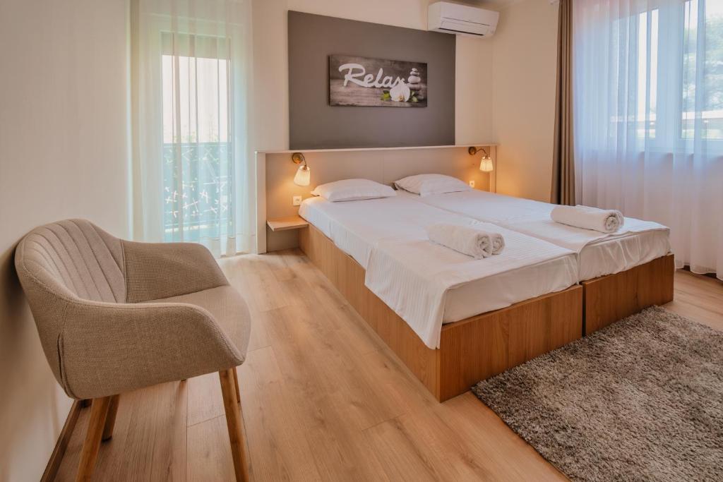 Postel nebo postele na pokoji v ubytování Luxury Apartments Vili