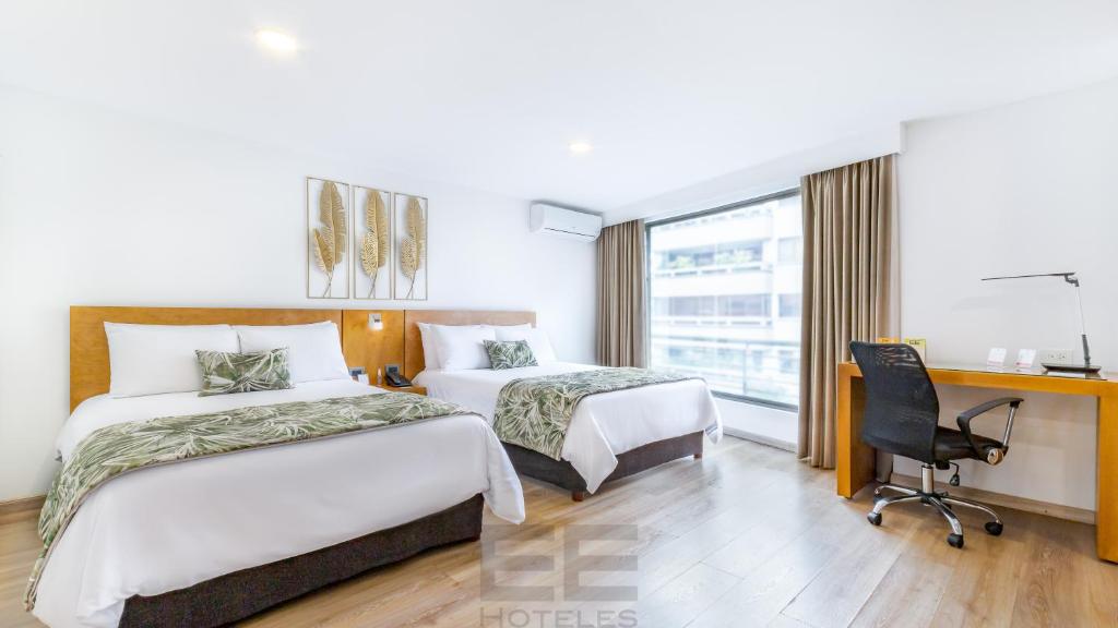 Uma cama ou camas num quarto em Leblón Suites Hotel