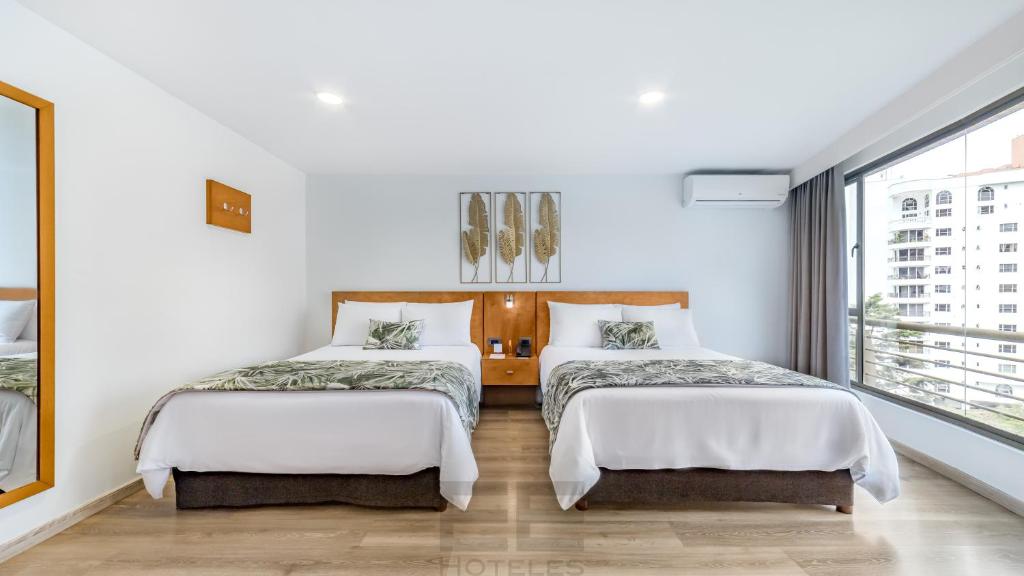 Uma cama ou camas num quarto em Leblón Suites Hotel