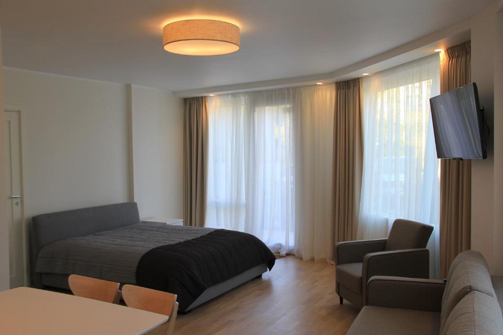 Katil atau katil-katil dalam bilik di Baltic Apartments Premium