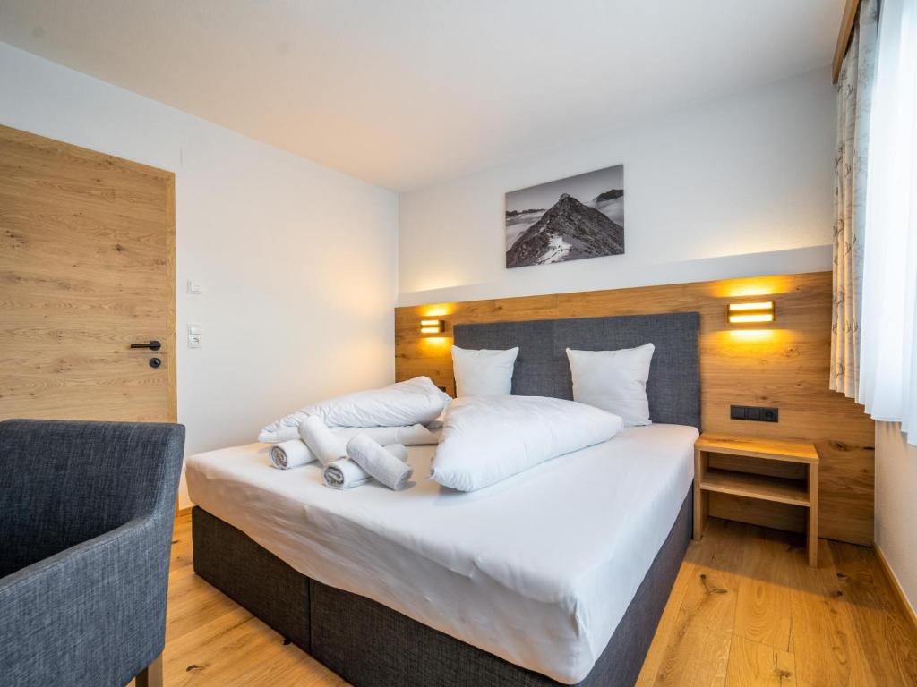 Posteľ alebo postele v izbe v ubytovaní Chalet Pettneu am Arlberg - Top 1