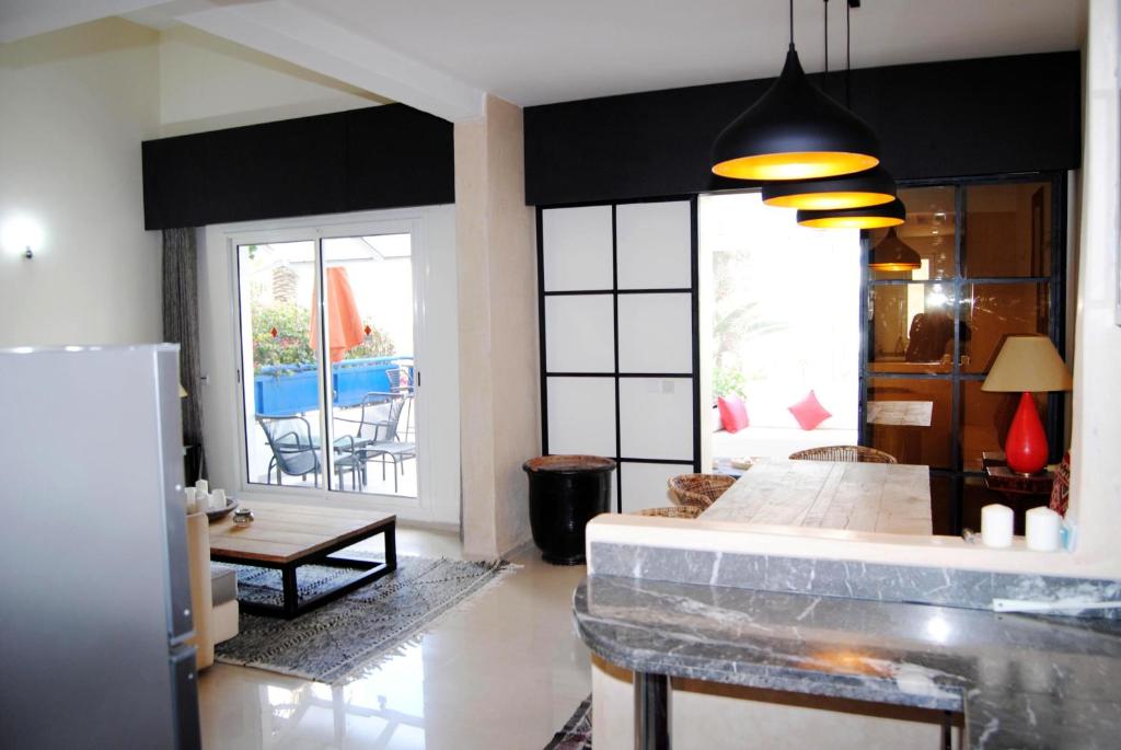 Katil atau katil-katil dalam bilik di Paradise Essaouira Appartement