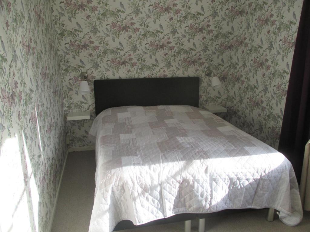 Postel nebo postele na pokoji v ubytování Vilan I Orbaden