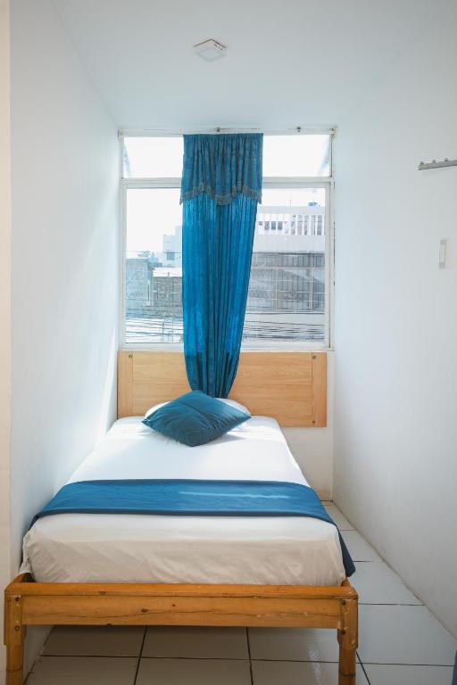 Postel nebo postele na pokoji v ubytování Hotel Casa Latina