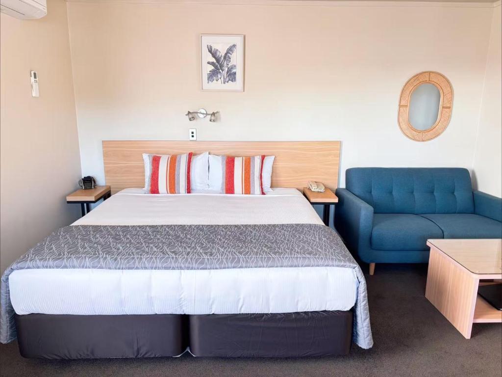 Postel nebo postele na pokoji v ubytování Arcadia Motel