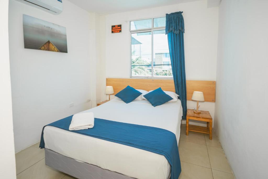 Postel nebo postele na pokoji v ubytování Hotel Casa Latina