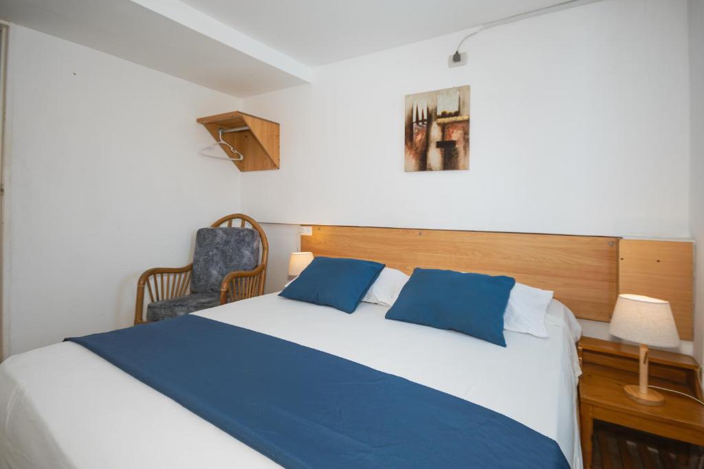 Postel nebo postele na pokoji v ubytování Hotel Casa Latina