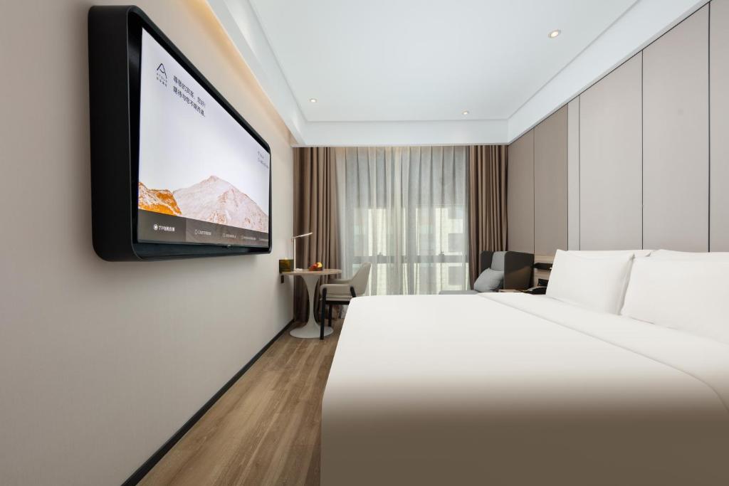 TV a/nebo společenská místnost v ubytování Atour Hotel Shanghai Hongqiao Korea Street