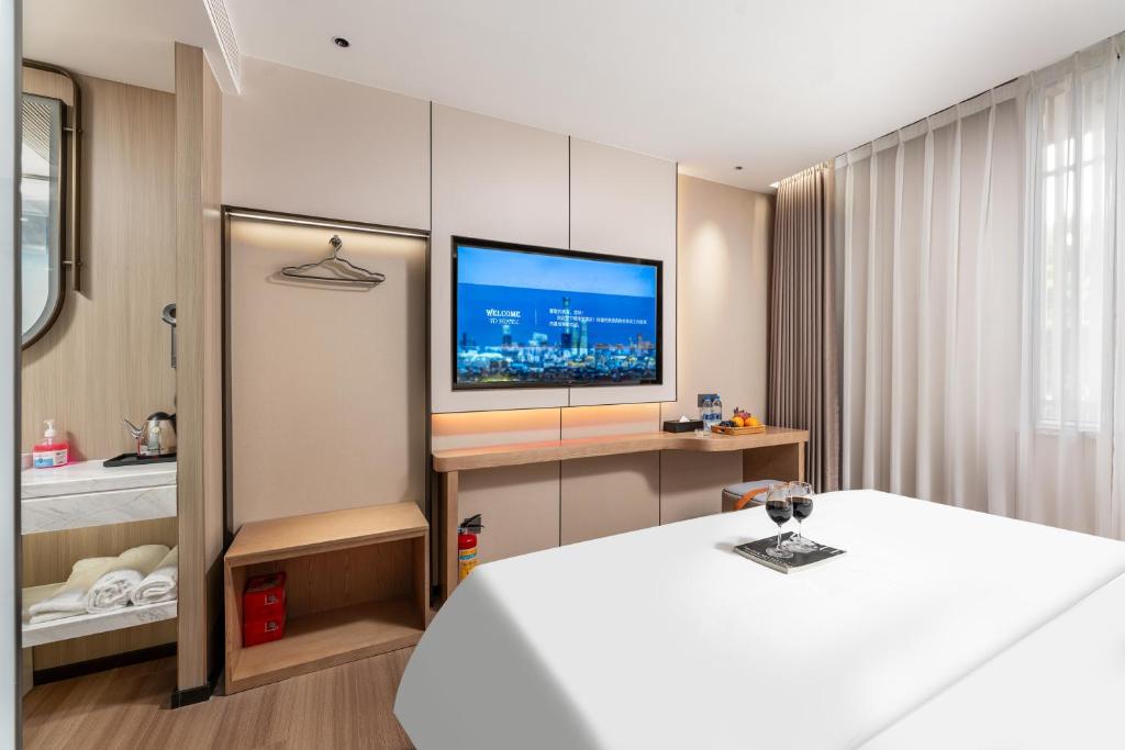 TV a/nebo společenská místnost v ubytování Guangzhou JinTang Hotel