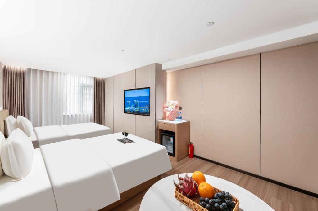 TV a/nebo společenská místnost v ubytování Guangzhou JinTang Hotel