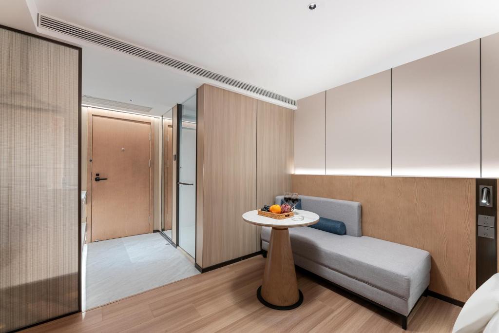 Postel nebo postele na pokoji v ubytování Guangzhou JinTang Hotel