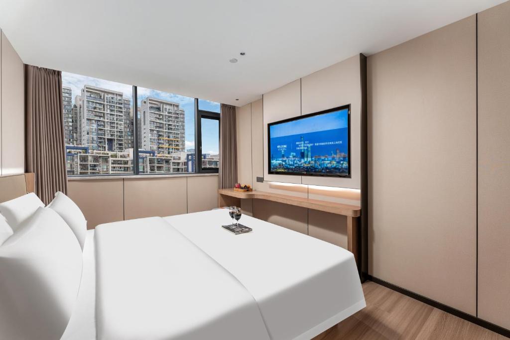 TV a/nebo společenská místnost v ubytování Guangzhou JinTang Hotel