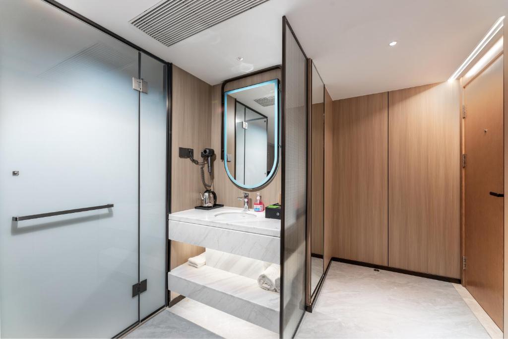 Postel nebo postele na pokoji v ubytování Guangzhou JinTang Hotel