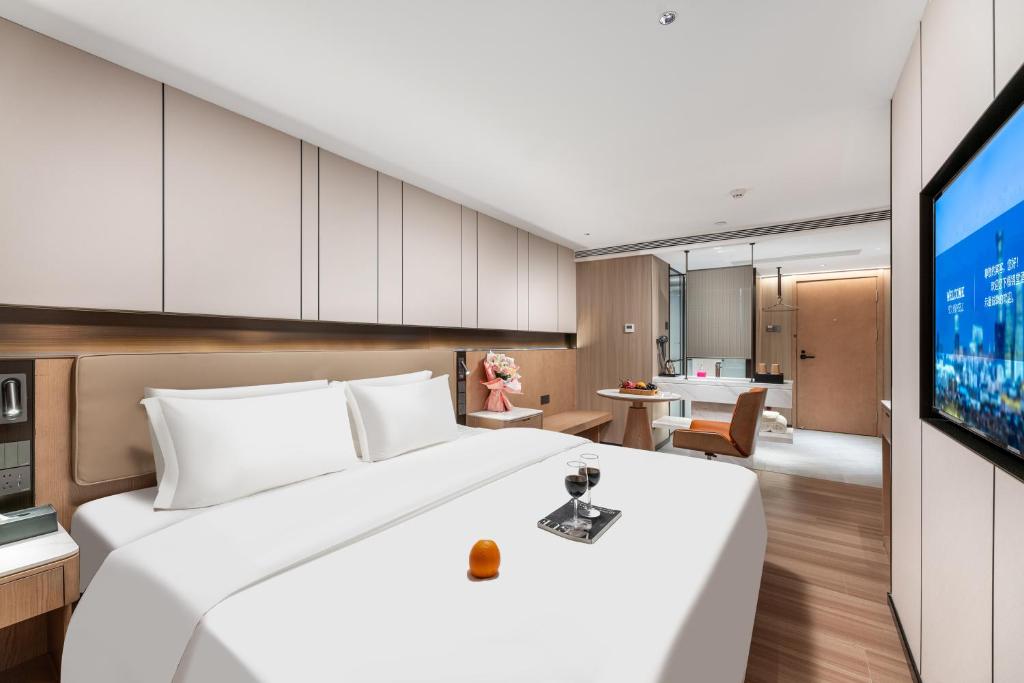 TV a/nebo společenská místnost v ubytování Guangzhou JinTang Hotel