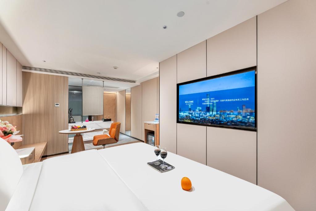 TV a/nebo společenská místnost v ubytování Guangzhou JinTang Hotel