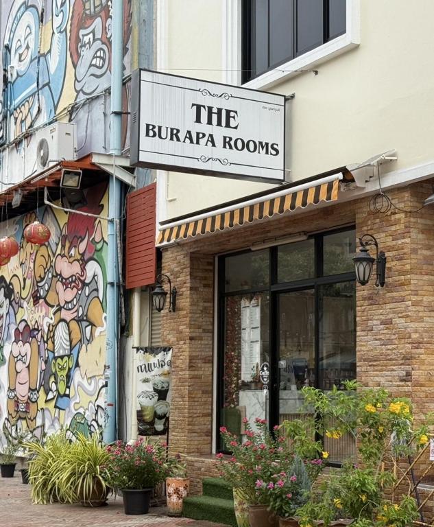 a building with a sign for the burra rooms at The Burapa Rooms in Bangkok