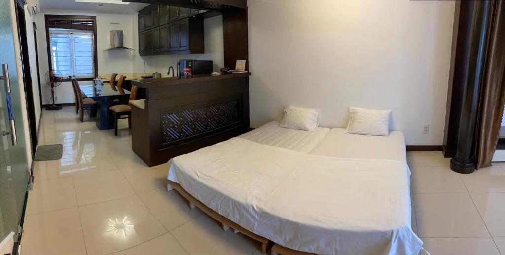 Postel nebo postele na pokoji v ubytování SOCHU HOUSE- Tuần Châu Homestay & Coffee