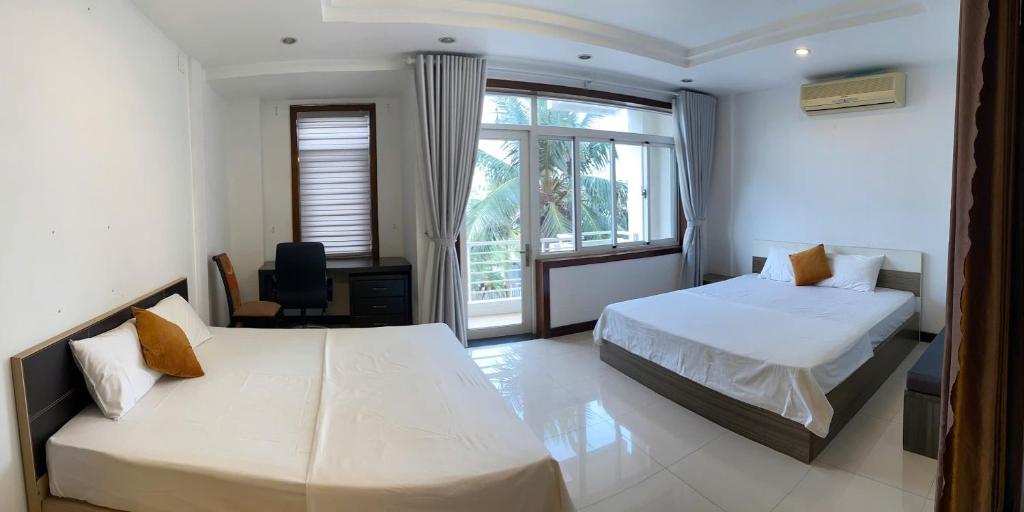 Postel nebo postele na pokoji v ubytování SOCHU HOUSE- Tuần Châu Homestay & Coffee