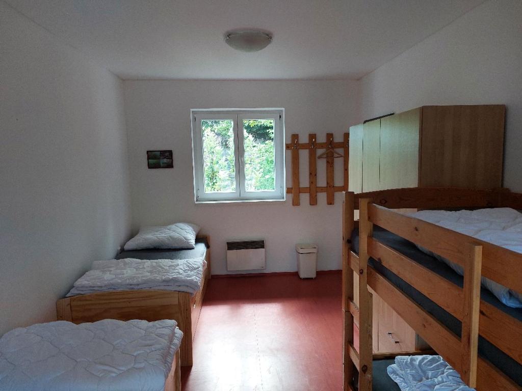 Postel nebo postele na pokoji v ubytování Divecentrum Rumchalpa