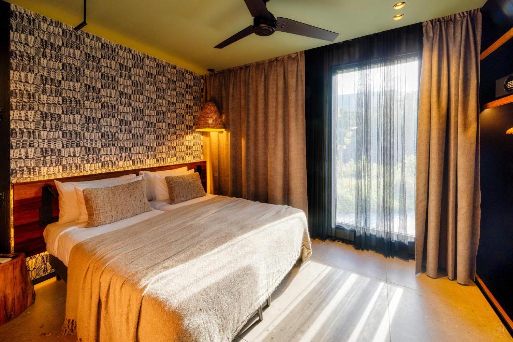 Postel nebo postele na pokoji v ubytování Wood Hôtel & Spa