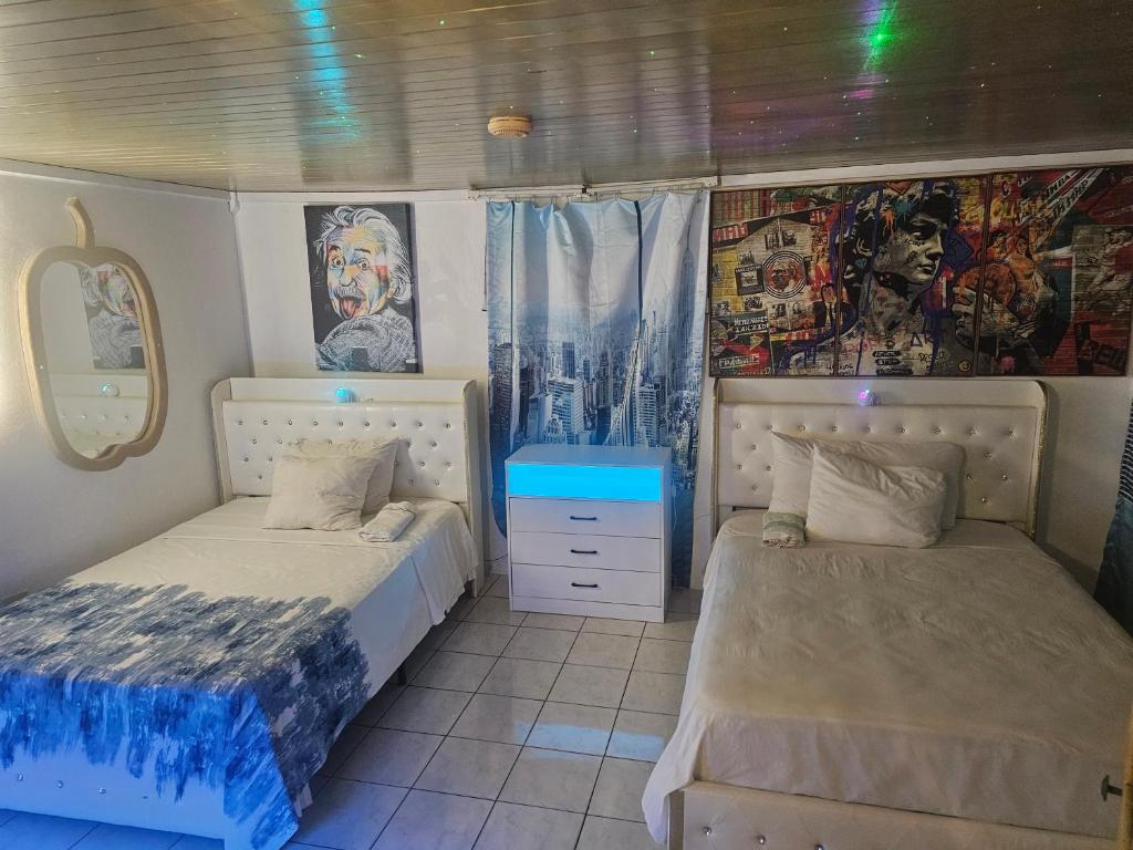 Postel nebo postele na pokoji v ubytování Big Apple Hotel