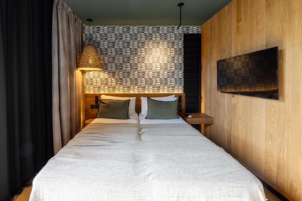 Postel nebo postele na pokoji v ubytování Wood Hôtel & Spa