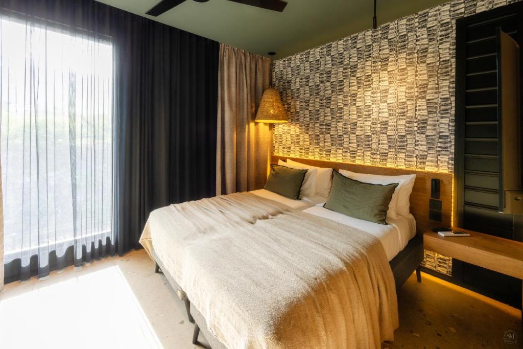 Postel nebo postele na pokoji v ubytování Wood Hôtel & Spa