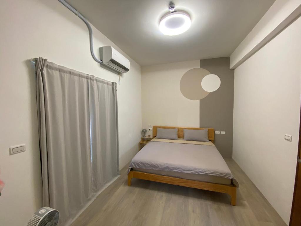 Postel nebo postele na pokoji v ubytování Wei Kun Homestay