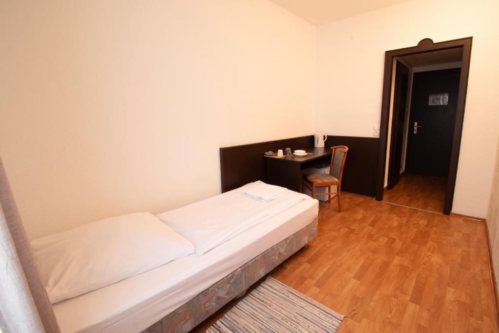 Cama ou camas em um quarto em Villa ENTO HotelWestEnd