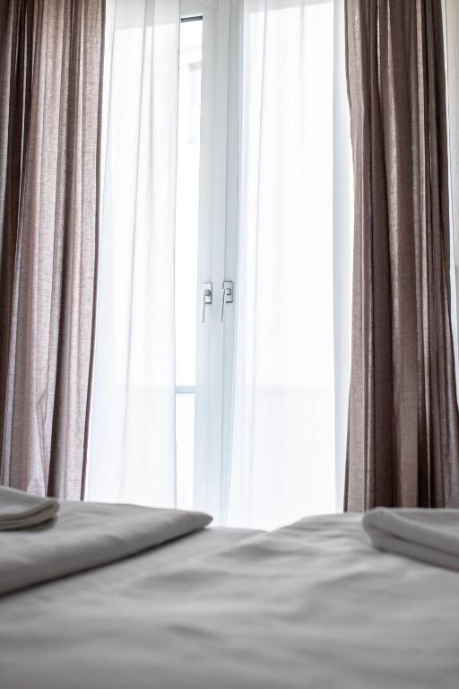 Cama ou camas em um quarto em Villa ENTO HotelWestEnd