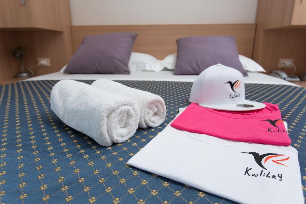 Postel nebo postele na pokoji v ubytování Hotel Souvenir - Koolibry Hotels