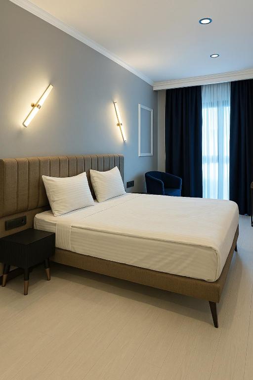 Cama ou camas em um quarto em Park Hotel & Private Transportation İstanbul Airport-By Loft